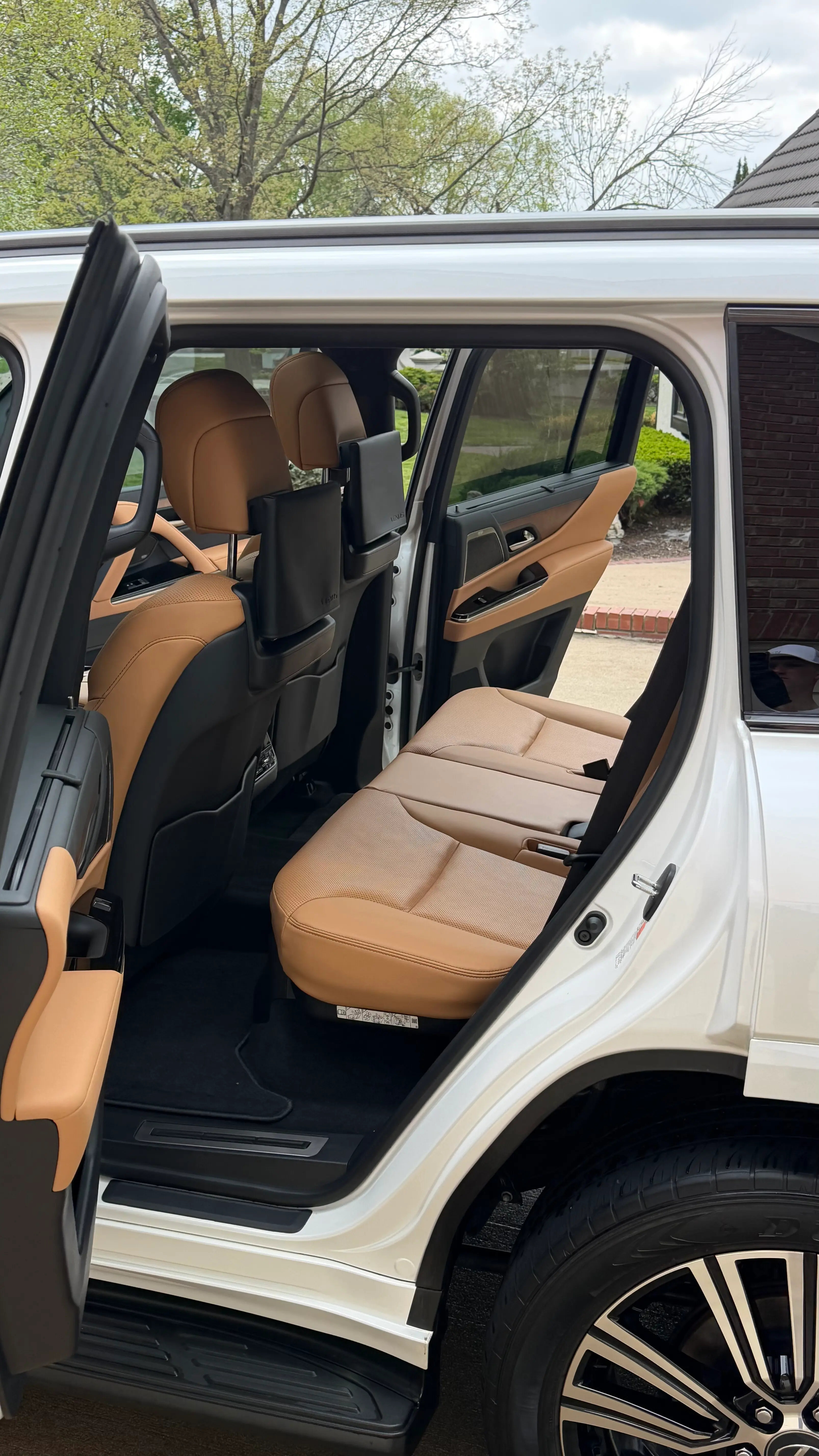 Tan leather rear seats after conditioning and detail